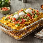 Walking taco casserole recipe served with Mexican rice and guacamole.