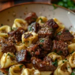 Cracked Garlic Steak Tortellini in Creamhouse Sauce served on a plate